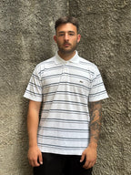 Polo Lacoste Uomo Bianca a Righe Blu con Logo Ricamato