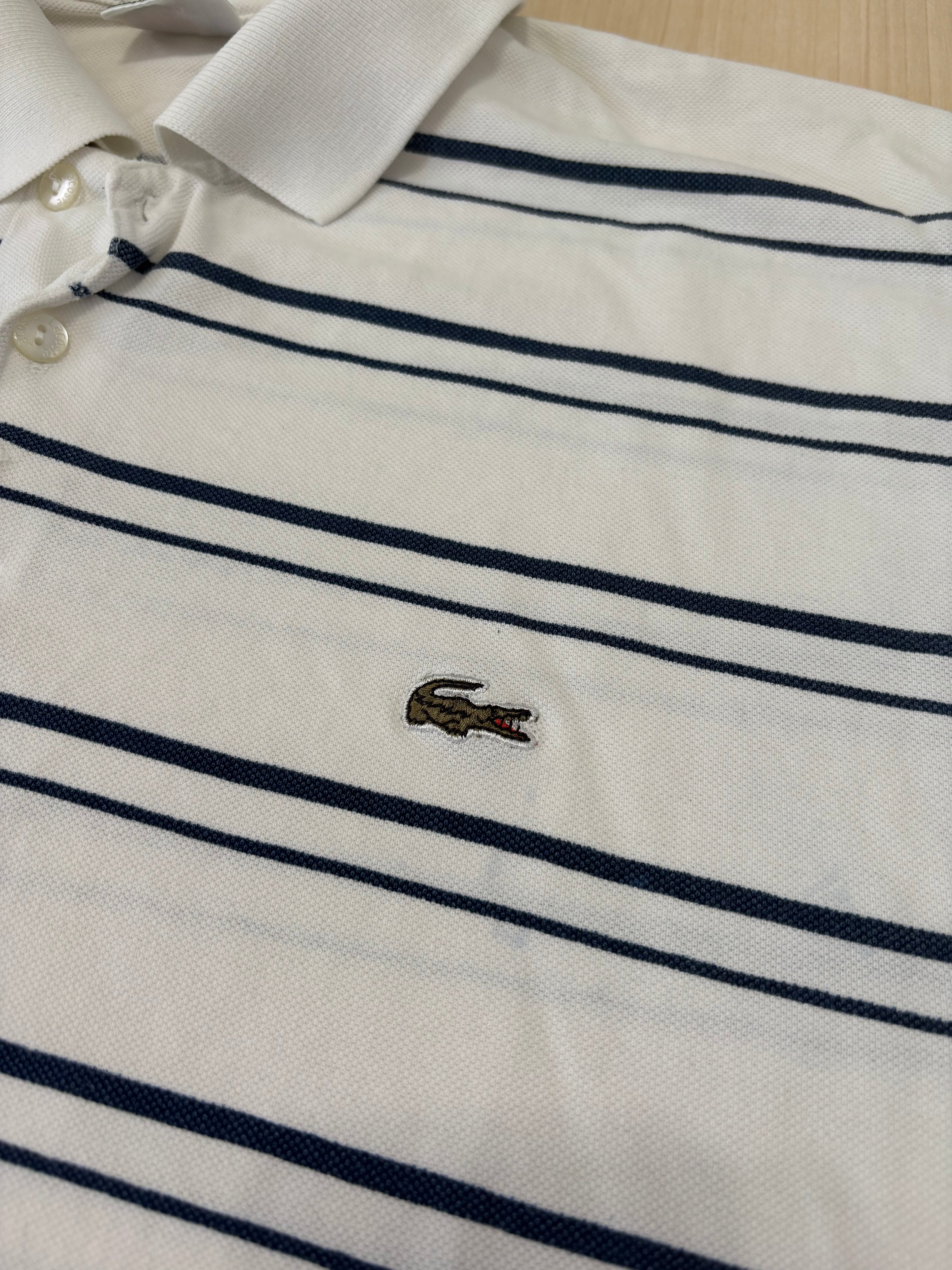 Polo Lacoste Uomo Bianca a Righe Blu con Logo Ricamato