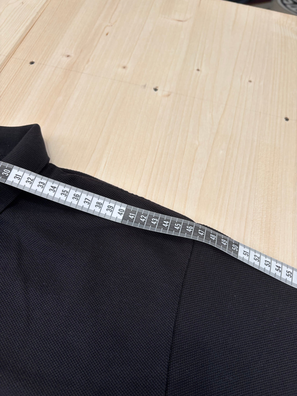 Polo Lacoste Uomo Nera con Logo Ricamato e Patch sulla Manica