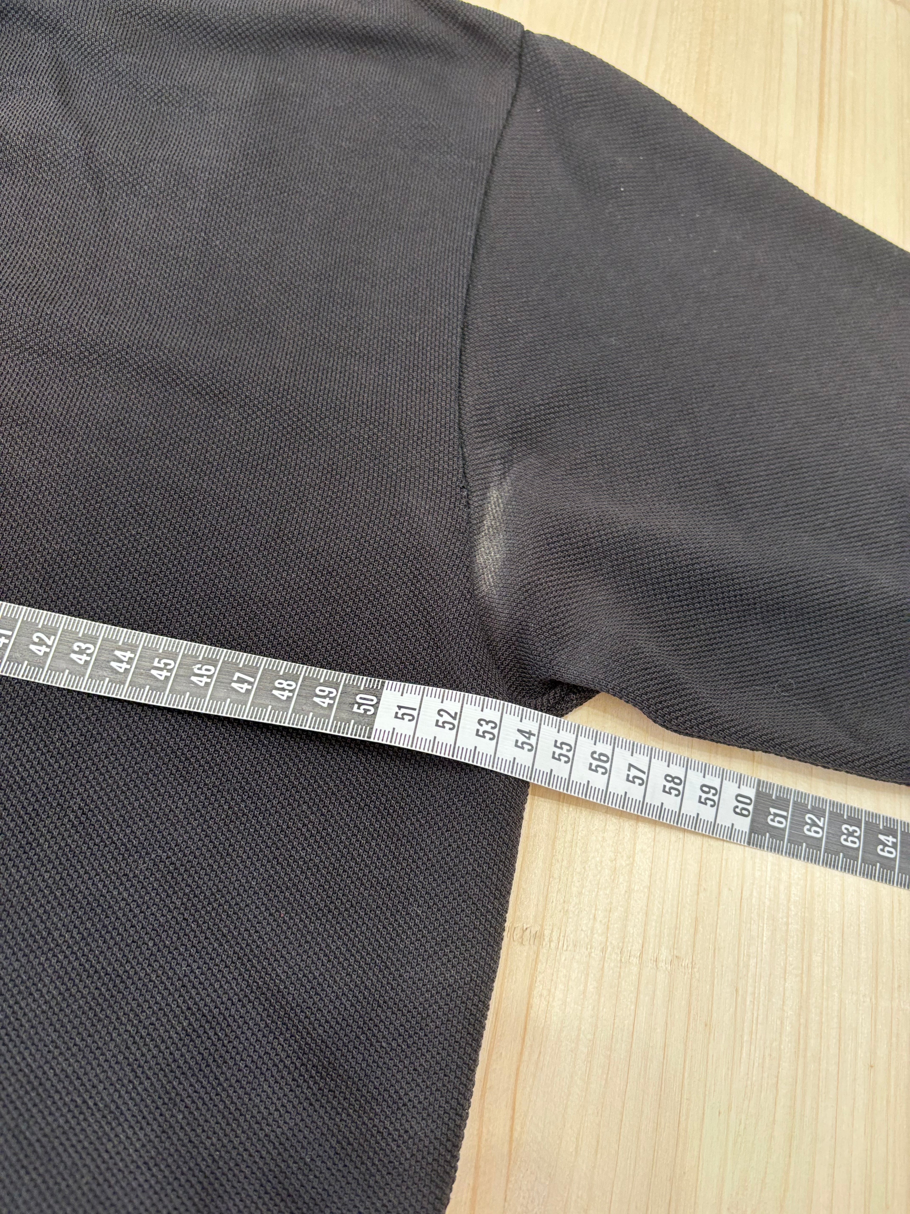 Polo Lacoste Uomo Nera con Logo Ricamato e Patch sulla Manica