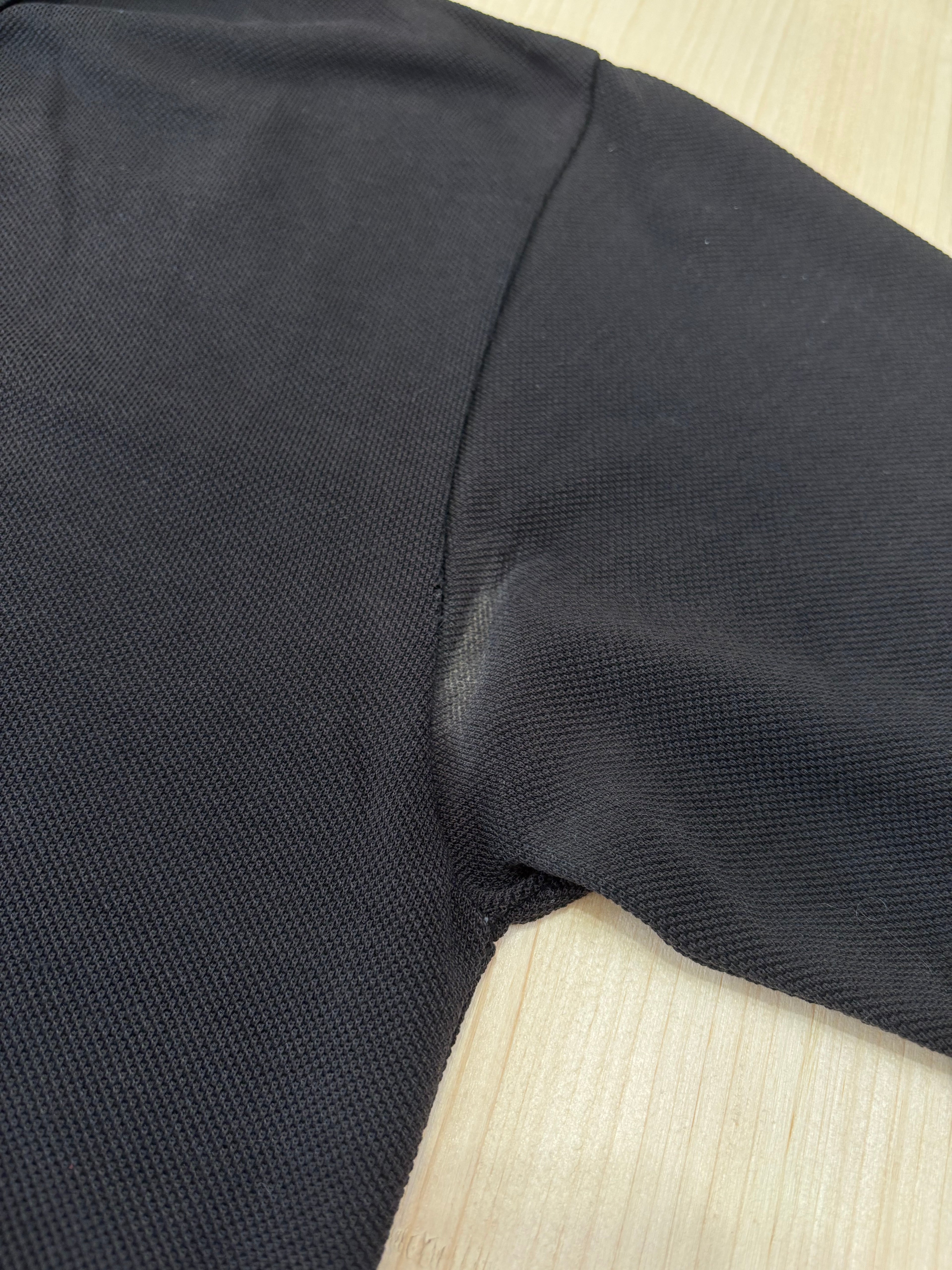 Polo Lacoste Uomo Nera con Logo Ricamato e Patch sulla Manica
