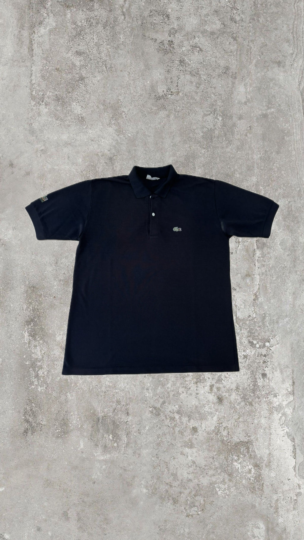 Polo Lacoste Uomo Nera con Logo Ricamato e Patch sulla Manica