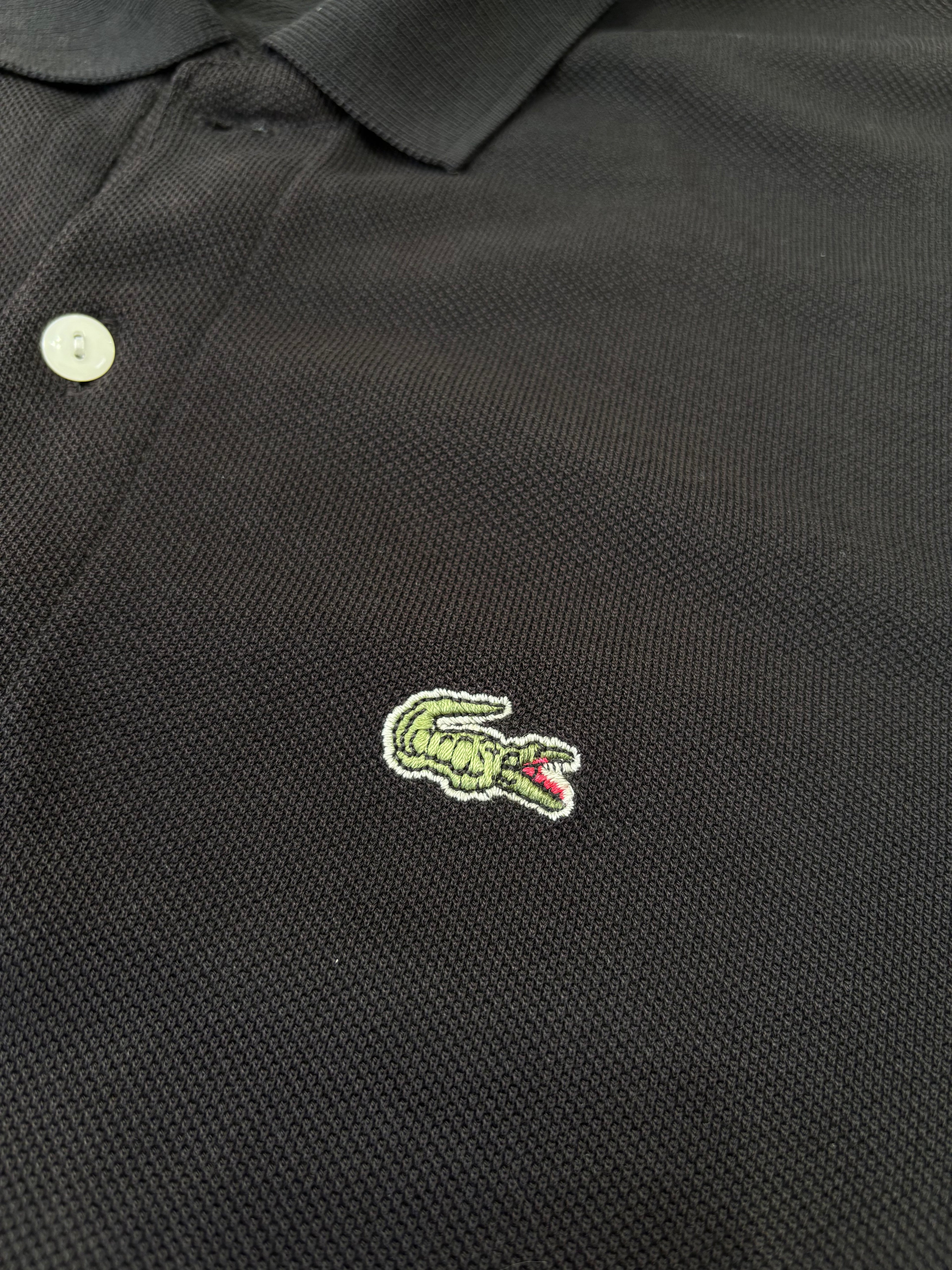 Polo Lacoste Uomo Nera con Logo Ricamato e Patch sulla Manica